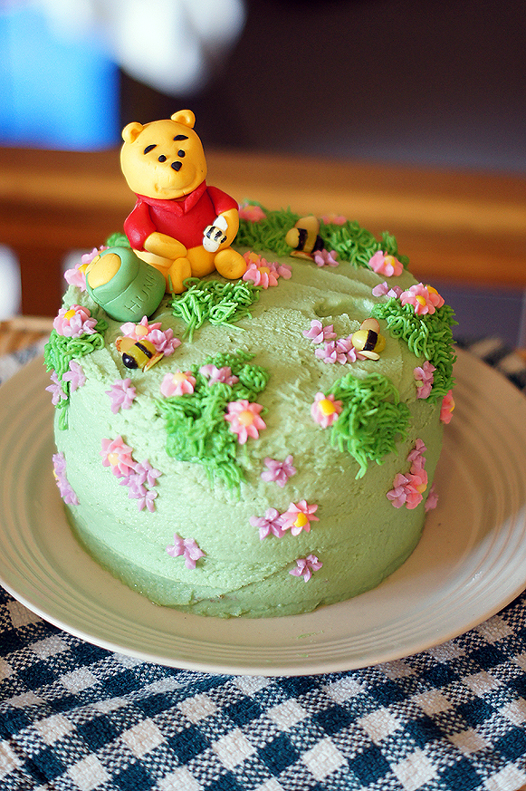 Birthday Cake with Winnie the Pooh Figurine · Free Stock Photo
